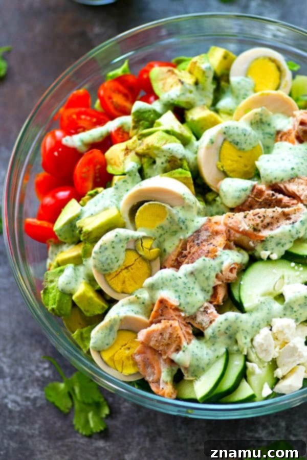 Grilled salmon fillets enhance the flavor and nutrition of this vibrant Cobb Salad.