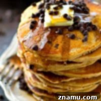 Almond butter makes these chocolate chip pancakes SO extra fluffy, you won't be able to resist devouring an entire stack! The batter mixes up in only minutes for a quick weekday breakfast.
