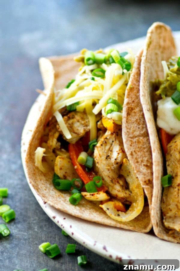 Sheet Pan Spicy-Sweet Chicken Tacos 2 Kickin chile-rubbed chicken and peppers bake up on one sheet pan to make these ULTIMATELY easy and flavorful chicken sweet peppers tacos! Load 'em up with all your favorite taco toppings.