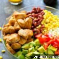 Zesty Blackened Chicken Avocado Bowl 8 Flavorful blackened chicken, avocado, and tons of other Mexican-style goodness collide in this loaded Mexican salad that is SO easy to throw together---you'll be making it all summer!