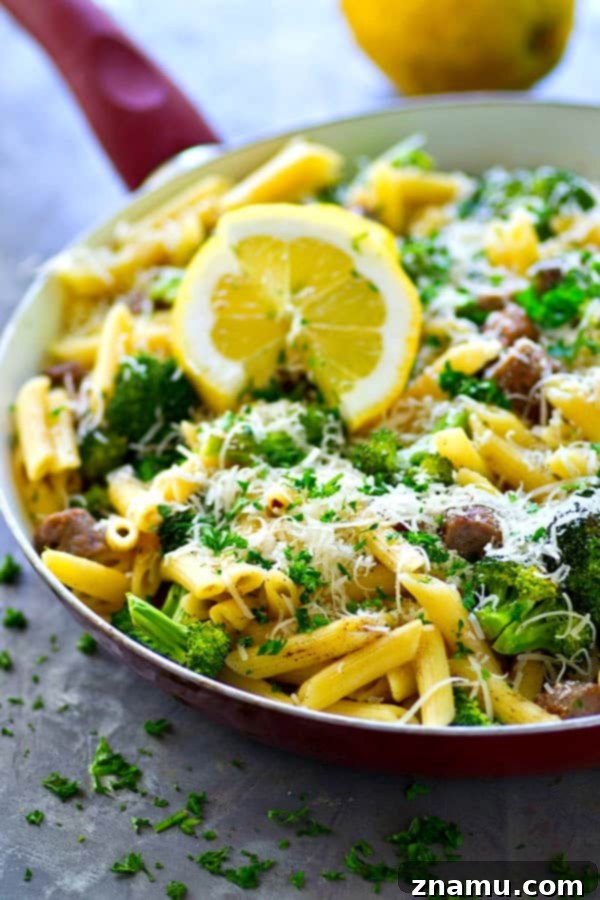 One-Pan Lemon Penne with Sausage and Roasted Broccoli 4 Sausage and pasta simmering in a skillet with lemon