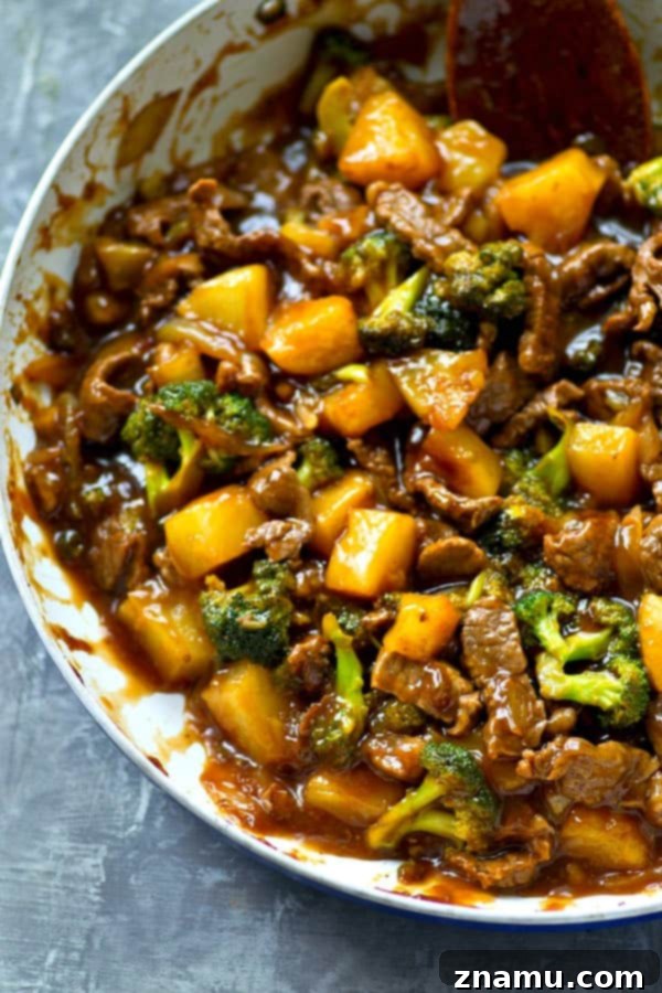 Golden Pineapple Beef and Broccoli Wok 3 Close-up of Pineapple Beef and Broccoli Stir-Fry with tender beef and vibrant vegetables