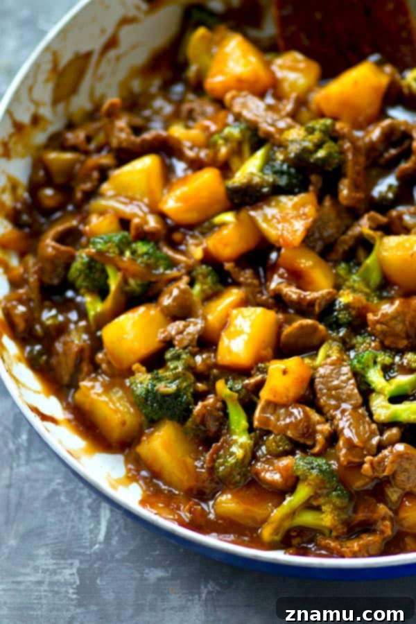 Golden Pineapple Beef and Broccoli Wok 5 Ingredient preparation for Pineapple Beef and Broccoli Stir-Fry, showing fresh broccoli and pineapple