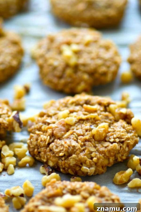 Close-up shot of no-bake banana pecan breakfast cookies with whole pecans visible