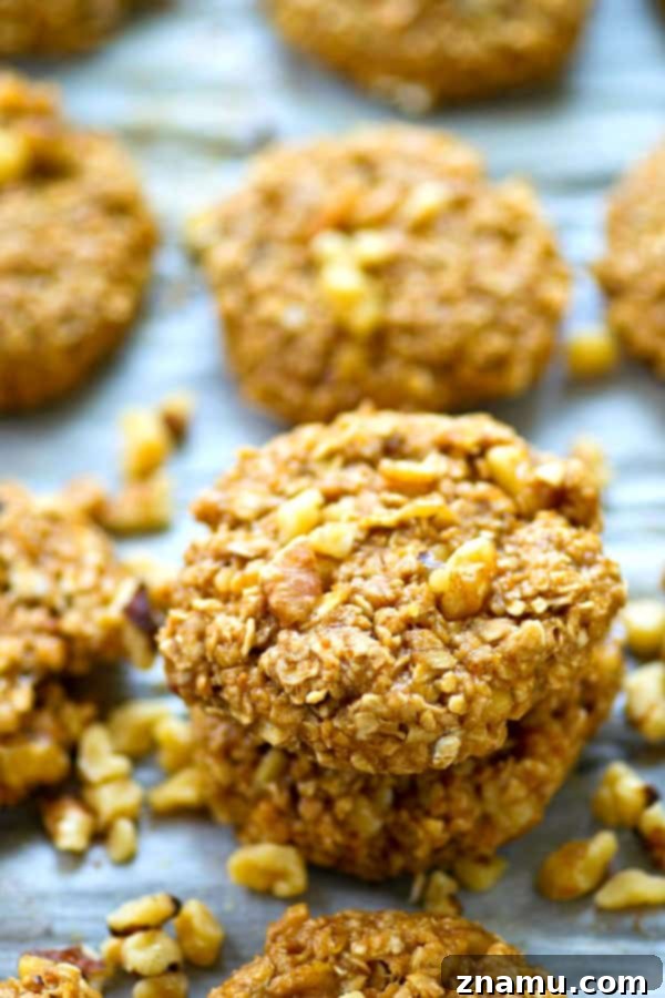 Stack of no-bake banana pecan breakfast cookies, showing their texture