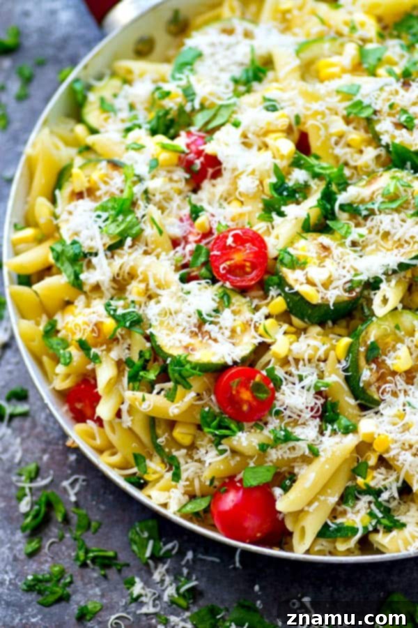 Sun-Kissed Grilled Summer Pasta 5 Fresh basil and cherry tomatoes scattered over Grilled Summer Vegetable Pasta Primavera