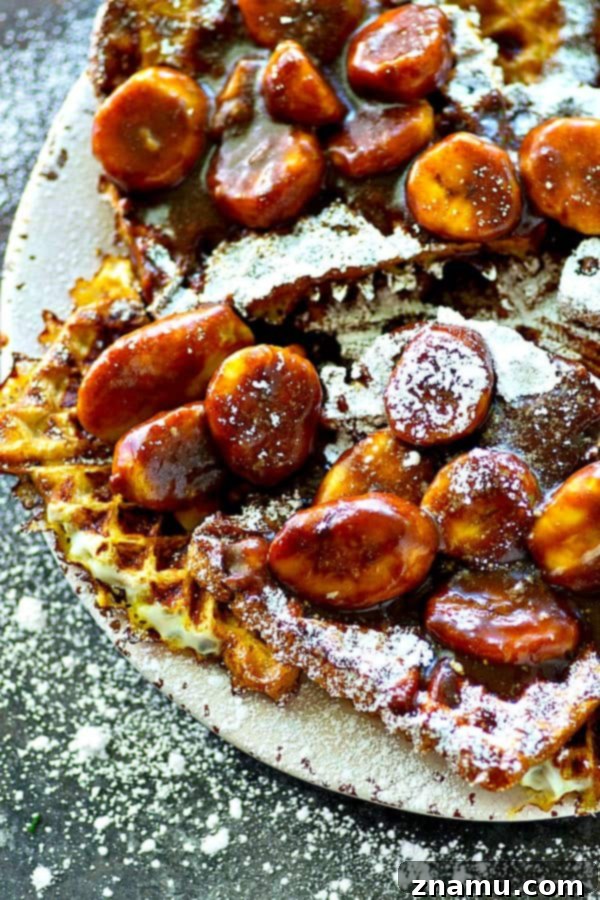 Crispy Waffled French Toast with Mocha Caramelized Bananas 5 A close-up of the rich, bubbling mocha caramelized banana sauce in a saucepan, showing the sliced bananas simmering in the dark, glossy, and fragrant concoction.