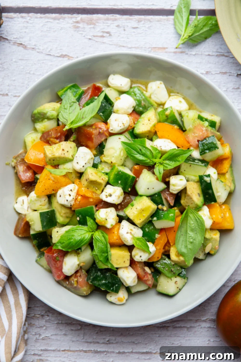 Classic Italian Tomato Cucumber Salad 6 A vibrant bowl of Italian Tomato Cucumber Salad, perfectly dressed and ready to be served.