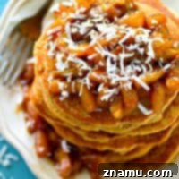 Coconut Cloud Pancakes with Zesty Orange-Pineapple Compote 8 Thumbnail image of fluffy coconut pancakes with orange pineapple compote.