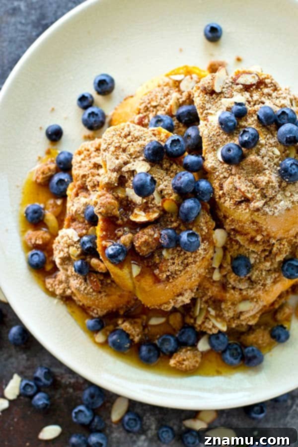 Decadent Baked Almond Streusel French Toast 3 Close-up of baked almond streusel French toast, showcasing the generous streusel topping.
