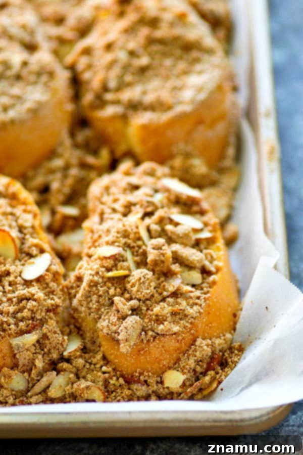 Decadent Baked Almond Streusel French Toast 5 A close-up shot of the unbaked almond streusel French toast, topped with streusel, before going into the oven.