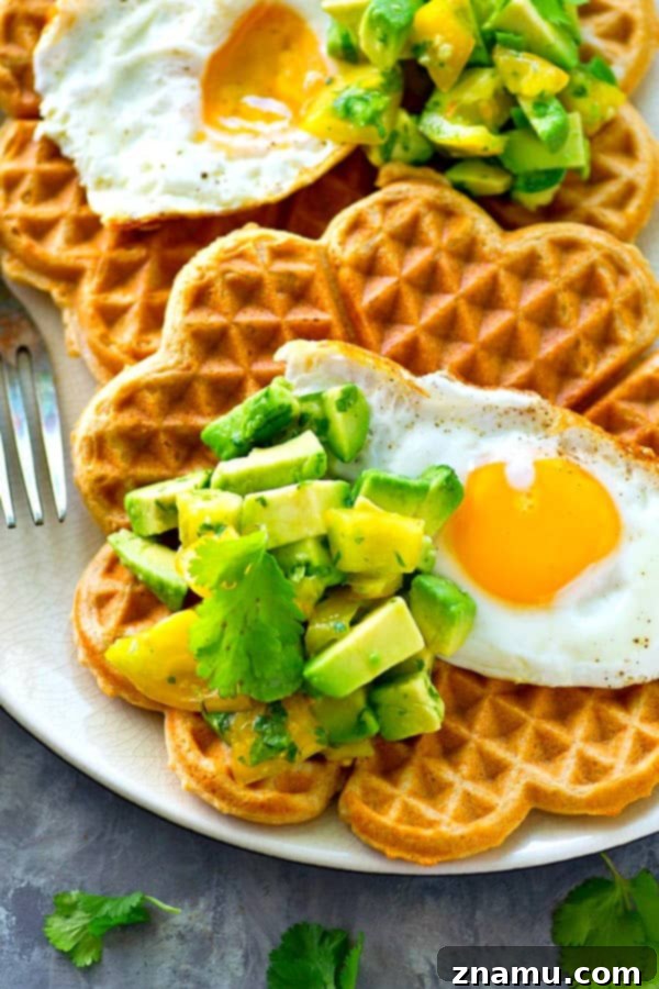 Savory Cornmeal Cheddar Waffles with Fried Eggs and Zesty Avocado Pico 4 Light and crispy cornmeal cheddar waffles are topped with a beautiful fried egg and tons of avocado pico de gallo for the BEST savory twist on waffles you'll ever have!