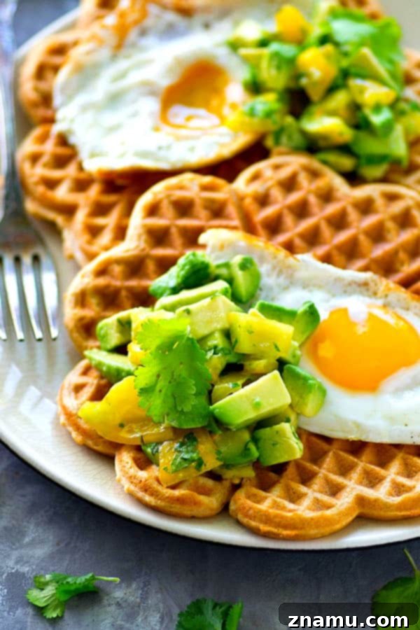 Savory Cornmeal Cheddar Waffles with Fried Eggs and Zesty Avocado Pico 5 Light and crispy cornmeal cheddar waffles are topped with a beautiful fried egg and tons of avocado pico de gallo for the BEST savory twist on waffles you'll ever have!