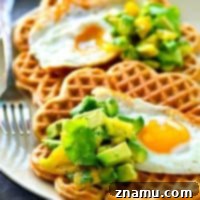 Savory Cornmeal Cheddar Waffles with Fried Eggs and Zesty Avocado Pico 7 Light and crispy cornmeal cheddar waffles are topped with a beautiful fried egg and tons of avocado pico de gallo for the BEST savory twist on waffles you'll ever have!