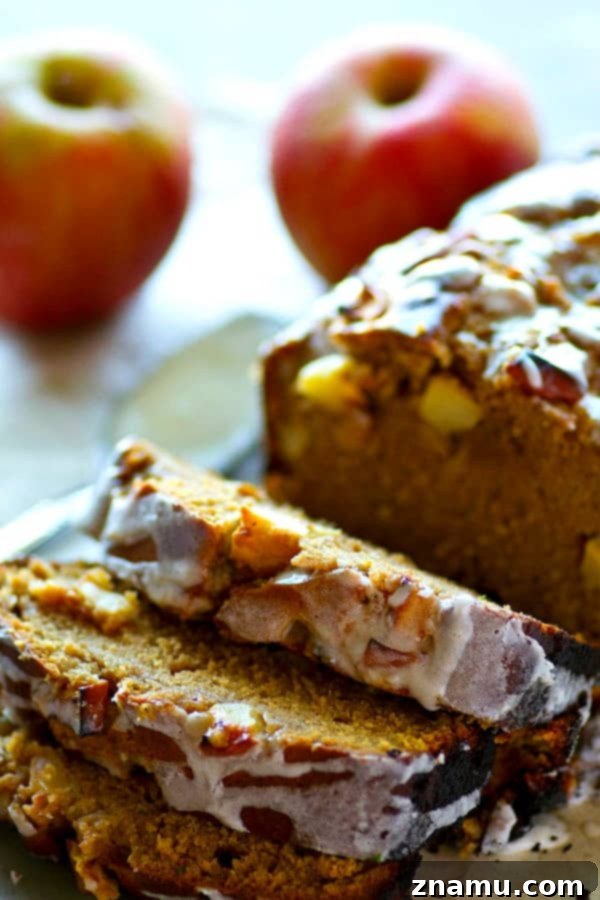 Cinnamon Apple Glazed Pound Cake 3 A stunning glazed apple pie pound cake, ready to be sliced, perfect for fall celebrations.