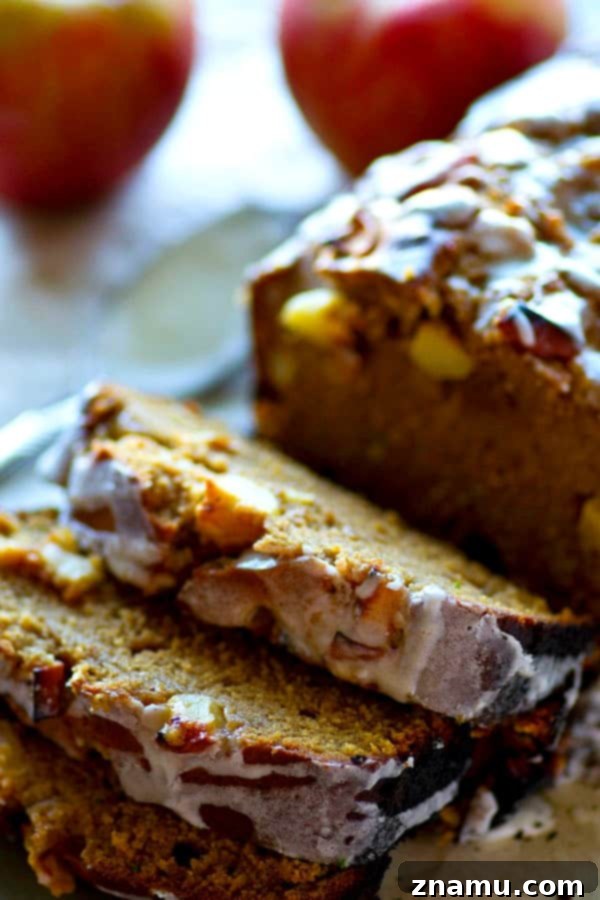 Cinnamon Apple Glazed Pound Cake 5 A freshly baked glazed apple pie pound cake, still in the loaf pan, cooling.