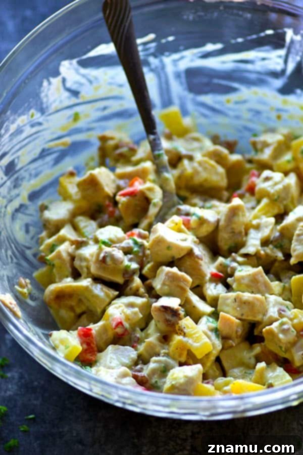 Sweet & Crunchy Pineapple Pecan Chicken Wraps 4 Detailed shot of the Pineapple Pecan Chicken Salad ingredients being mixed in a bowl.