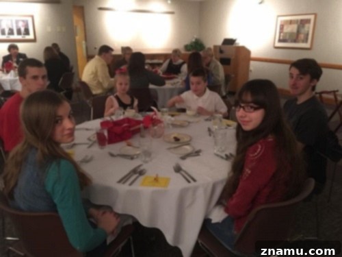 The Fourth Course of Culinary School 12 Family Gathered at Tables for Gourmet Luncheon