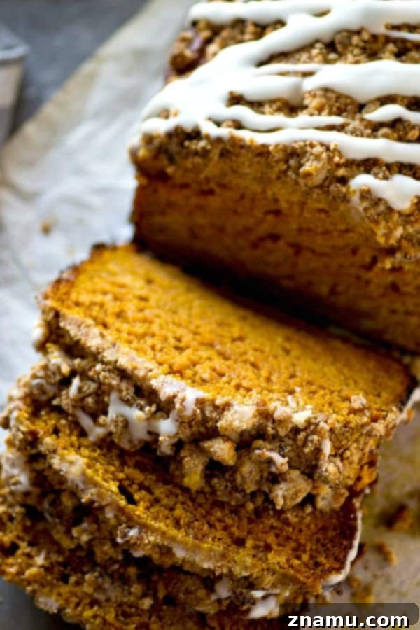 Coffee Glazed Pumpkin Streusel Bread 5 Serving of Streusel Pumpkin Bread with Coffee Glaze on a plate