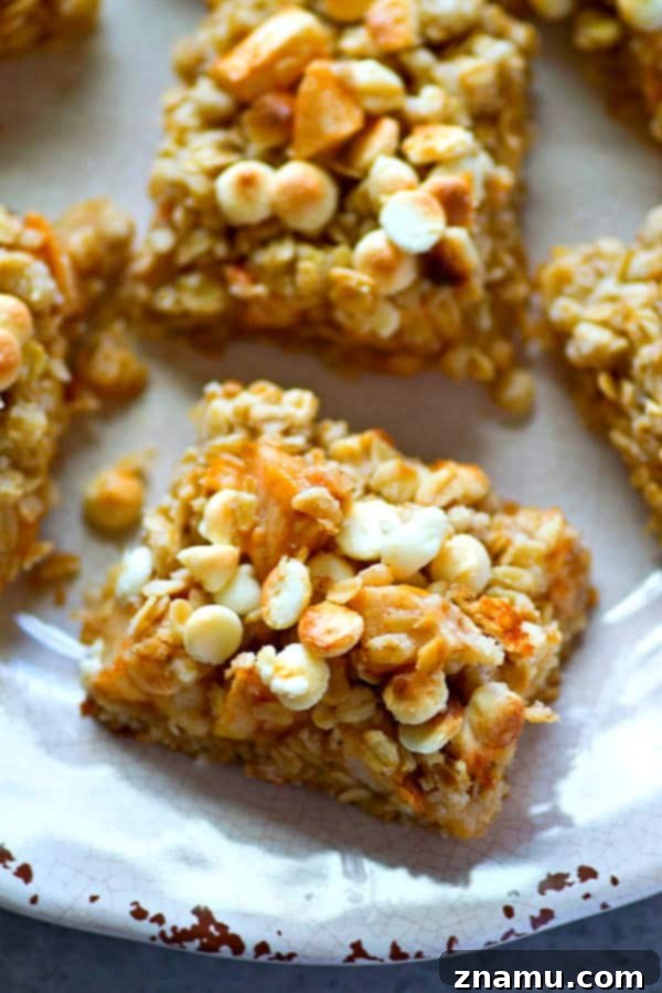 White Chocolate Apple Oatmeal Delights 3 White chocolate, oatmeal, and apples are a trio made in heaven in these streusel-covered cookie bars! So easy to make and you won't be able to stop eating them!