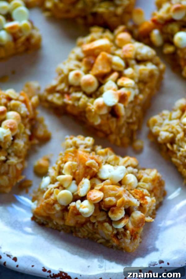 White Chocolate Apple Oatmeal Delights 4 White chocolate, oatmeal, and apples are a trio made in heaven in these streusel-covered cookie bars! So easy to make and you won't be able to stop eating them!