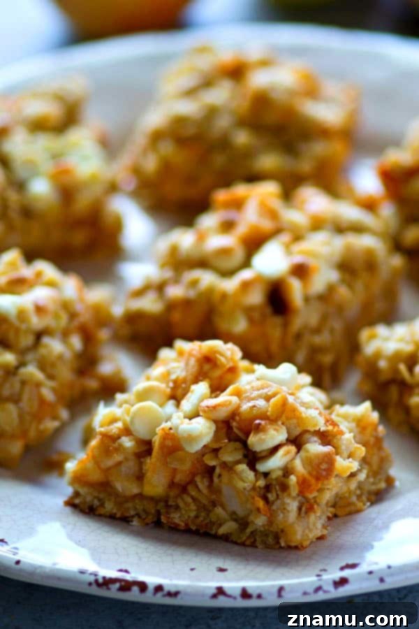 White Chocolate Apple Oatmeal Delights 5 White chocolate, oatmeal, and apples are a trio made in heaven in these streusel-covered cookie bars! So easy to make and you won't be able to stop eating them!