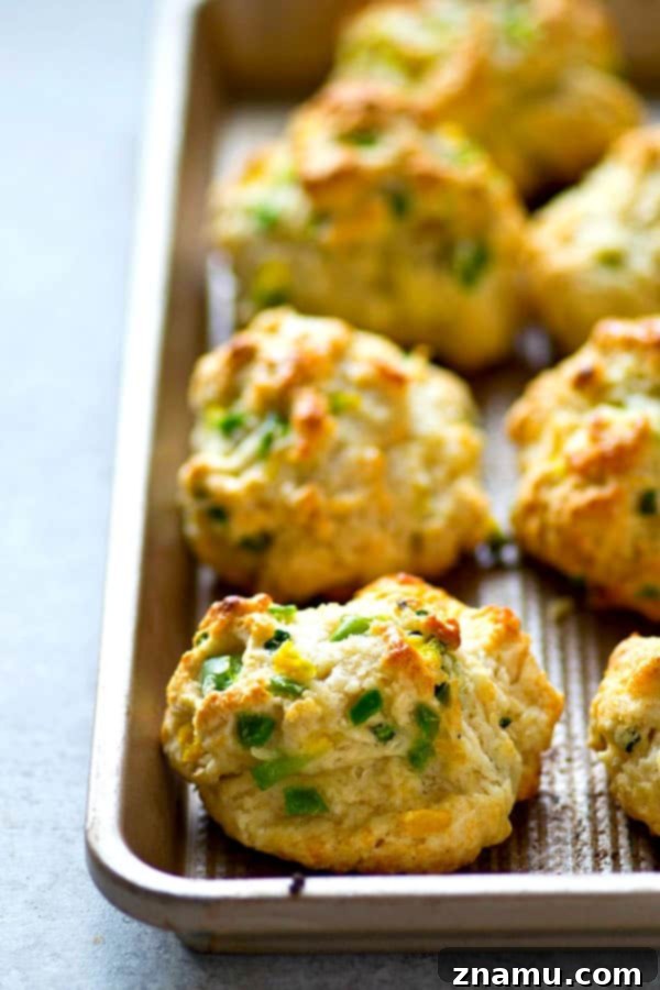 Sweet Heat Buttermilk Drop Biscuits 3 Close-up of golden brown honey jalapeño buttermilk drop biscuits.