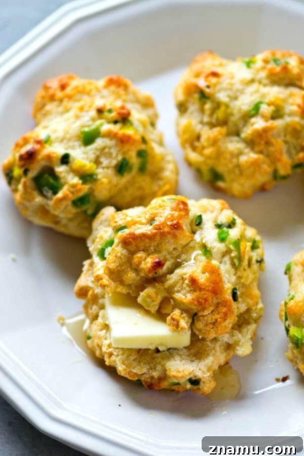 Sweet Heat Buttermilk Drop Biscuits 4 Freshly baked buttermilk drop biscuits with a golden crust.