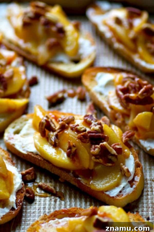 Caramel Apple Cream Cheese Crostini 4 Overhead shot of several slices of Caramelized Apple Cream Cheese Bruschetta arranged on a serving board.