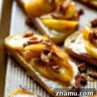 Sweet 'n' spiced caramelized apples piled high on top of cream cheese and crisp french bread is a match made in HEAVEN in this gorgeous cream cheese bruschetta!