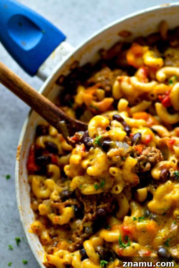 Lean Skillet Beef Chili Mac n Cheese 2 Lighter One-Pot Beef Chili Mac and Cheese: A full pot of creamy, cheesy, and spicy goodness, ready to be served.