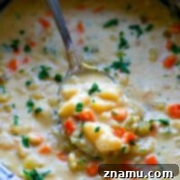 A lighter and easier spin on a comfort food classic! This creamy baked potato cheddar soup makes itself in the crockpot and it's going to quickly become a dinner staple in your house!