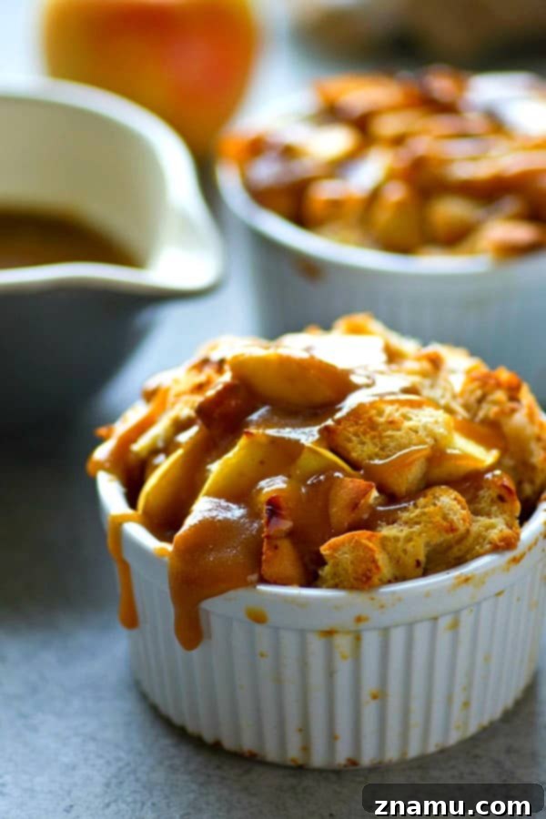 Close-up of a mini caramel apple french toast bake drizzled with homemade caramel sauce