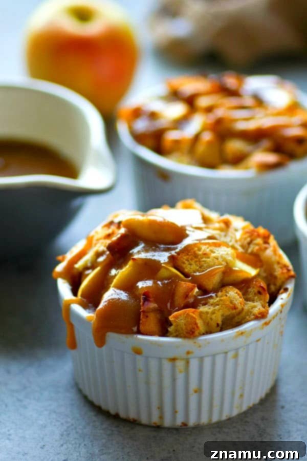 Individual caramel apple french toast bake covered in rich homemade caramel sauce