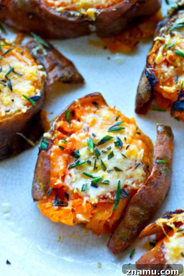 Brown Butter Parmesan Sweet Potato Smash 5 Platter of finished Browned Butter Parmesan Smashed Sweet Potatoes garnished with fresh rosemary