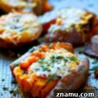 Small close-up of a single crispy smashed sweet potato with Parmesan