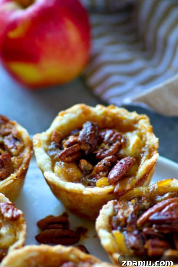 Caramel Apple Pecan Mini Pies 5 Warm mini caramel apple pecan pies cooling on a wire rack