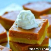 Spiced Bourbon Pumpkin Cookie Bars 7 A small image of a Sugar Cookie Bourbon Pumpkin Pie Bar with whipped cream