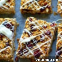 Heavenly White Chocolate Cranberry Granola Bars 7 Cranberry bliss bars meet granola bar! These white chocolate cranberry bliss granola bars are so soft, chewy, packed with tangy cranberries, and drizzled with tons of white chocolate!