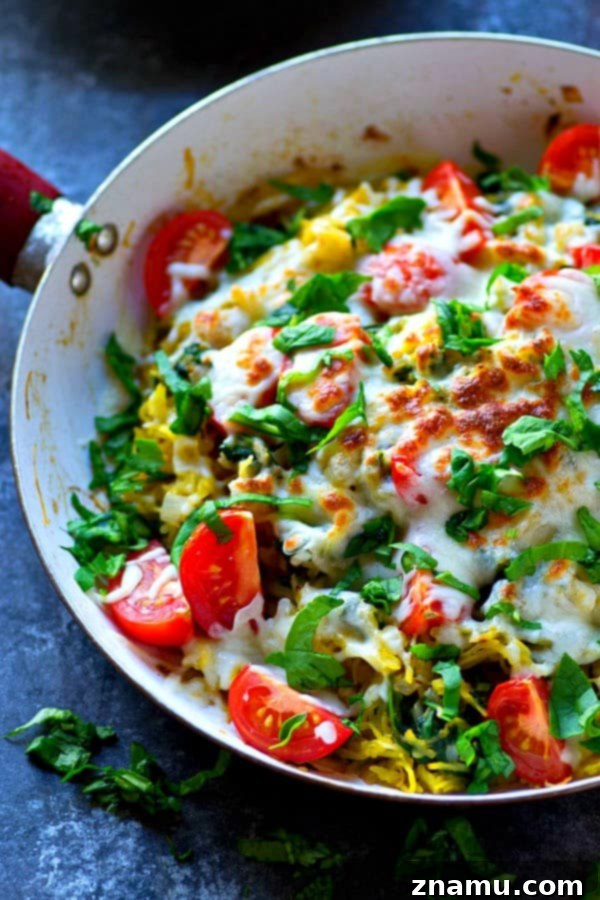 Vibrant Caprese Squash Skillet 3 Cooked spaghetti squash halves, ready to be shredded into noodles.