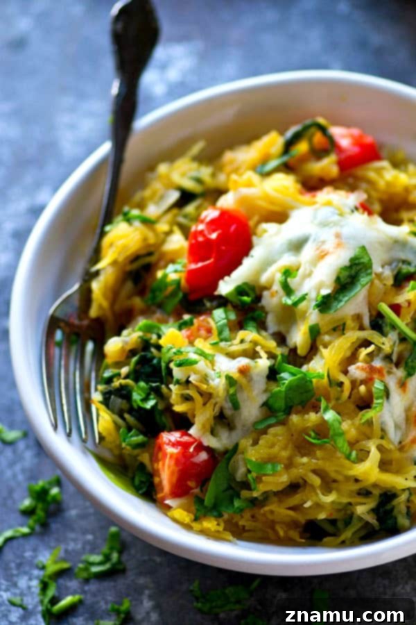 Vibrant Caprese Squash Skillet 5 Caprese Spaghetti Squash Skillet with bubbly, golden-brown mozzarella fresh from the broiler.