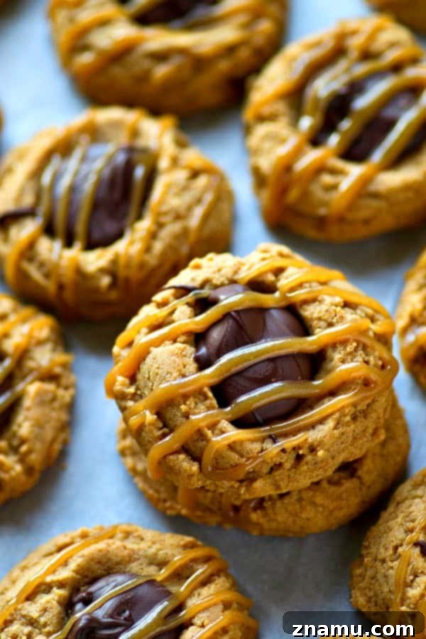Close-up of a stack of peanut butter caramel chocolate thumbprints