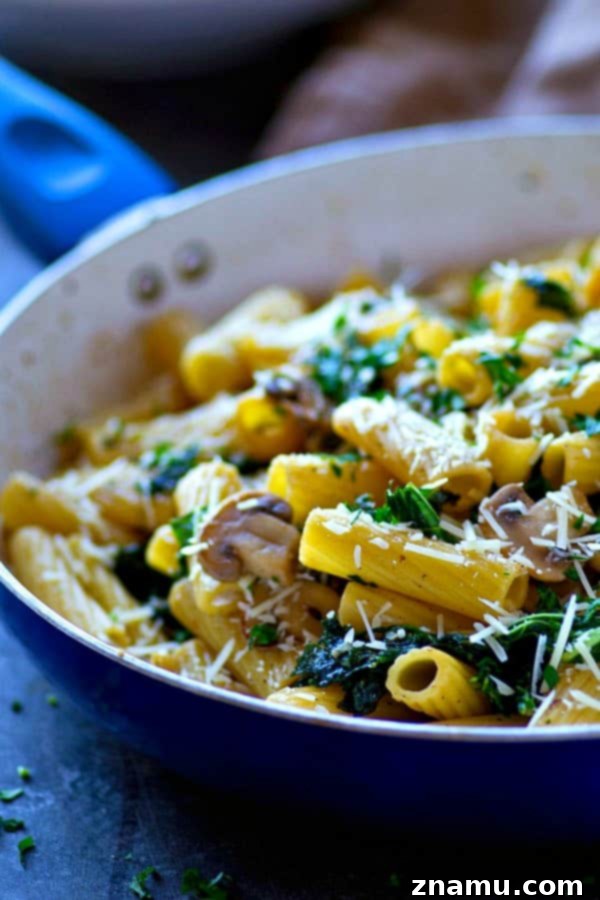 Browned Butter Rigatoni with Caramelized Mushrooms and Kale 3 A delicious skillet of rigatoni pasta featuring deeply caramelized mushrooms and tender green kale, ready to be tossed.