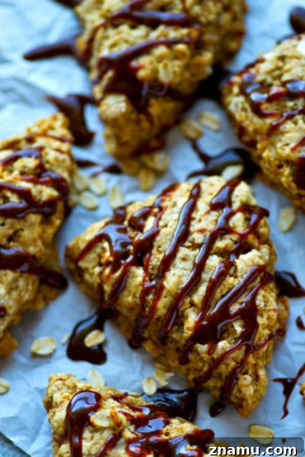 Coffeehouse Caramel Macchiato Oatmeal Scones 3 Close-up of a stack of Caramel Macchiato Oatmeal Scones, showcasing the tender crumb and thick caramel drizzle