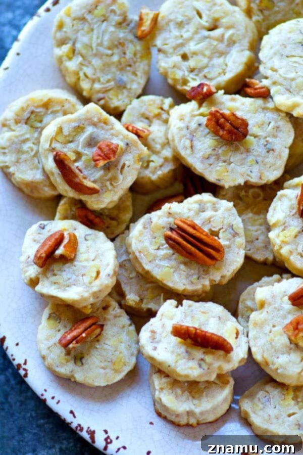Golden Slice-and-Bake Butter Pecan Coconut Treats 2 The EASIEST slice 'n' bake cookies you'll make this holiday season! These butter pecan coconut cookies are soft, buttery, and absolutely impossible to stop eating.