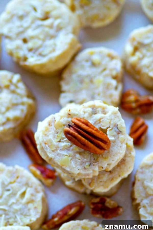 Golden Slice-and-Bake Butter Pecan Coconut Treats 4 The EASIEST slice 'n' bake cookies you'll make this holiday season! These butter pecan coconut cookies are soft, buttery, and absolutely impossible to stop eating.