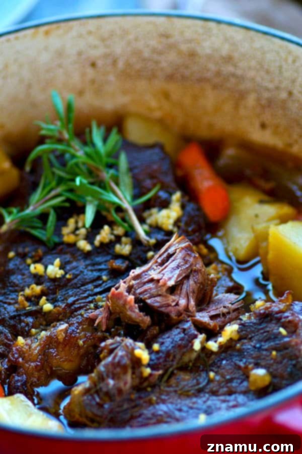 Orchard-Braised Pot Roast 4 Juicy beef pot roast with tender root vegetables in a Dutch oven