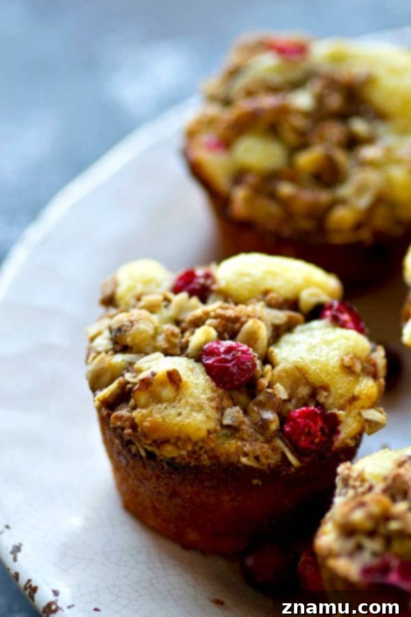A selection of Cranberry Lemon Walnut Crumb Muffins beautifully arranged, emphasizing their fresh appeal and generous streusel.