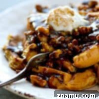Spiced Gingerbread French Toast with Toasted Walnut Caramel Drizzle 7 Thumbnail image of a delicious Gingerbread French Toast stack with rich walnut caramel, representing the featured recipe.