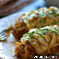 Loaded French Onion Hasselback Potatoes 7 Hasselback baked potatoes are filled with tons of caramelized onions and topped off with Swiss cheese for one knock-out easy dinner side!